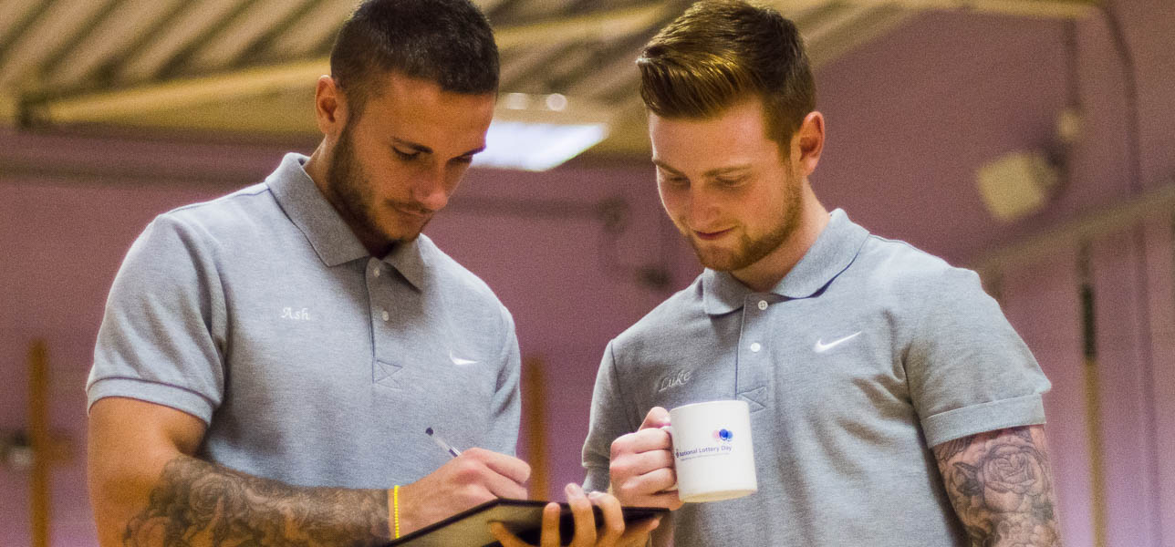 The team checking client progress on work sheet